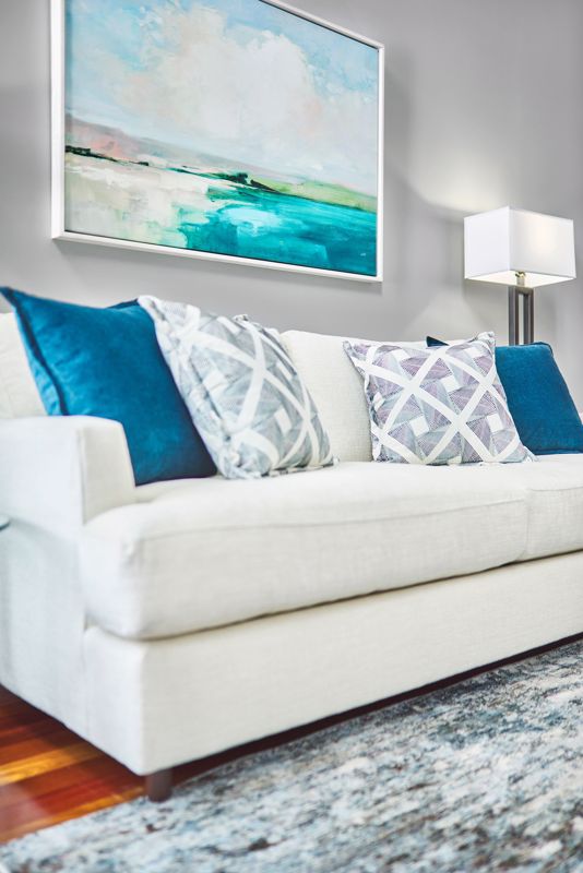 White Sofa with Blue Cushions