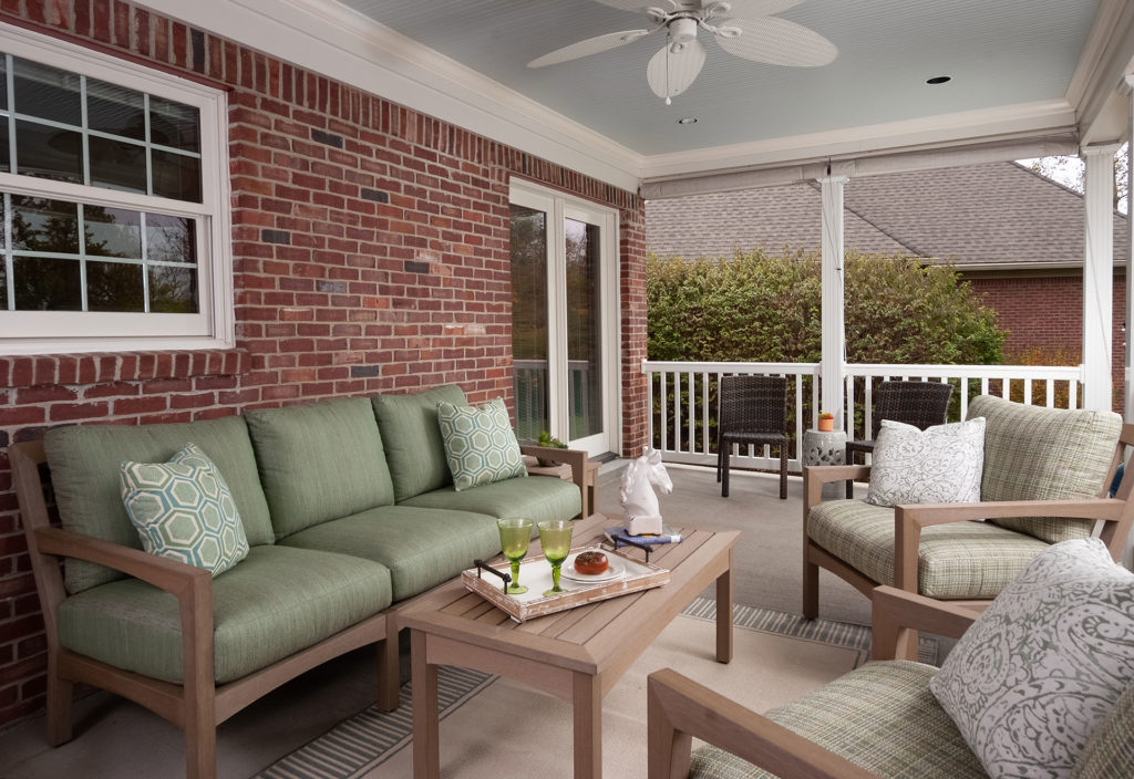 Outdoor lounge with muted green colors