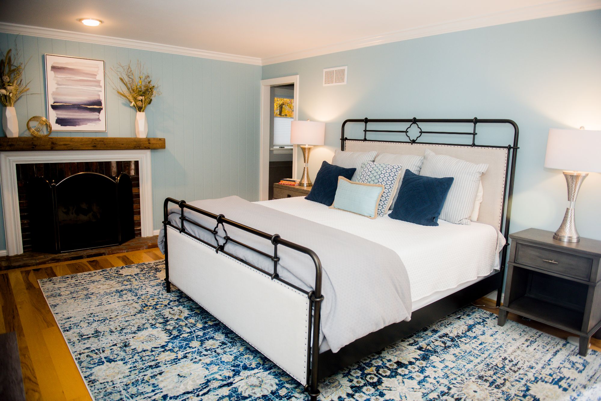 a bold light blue backdrop in a master bedroom