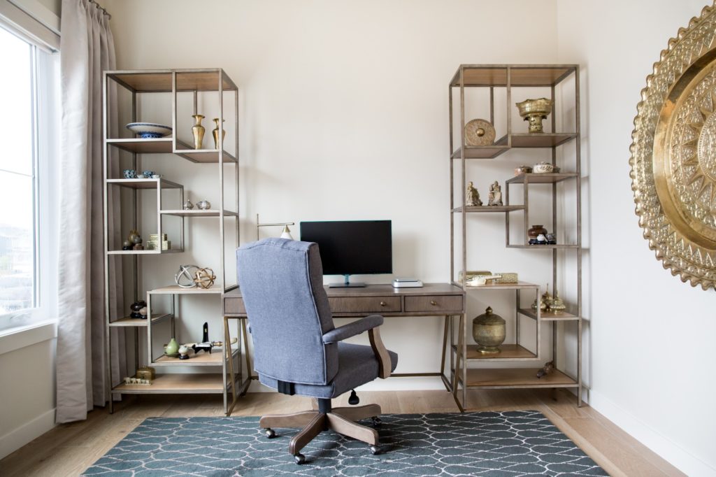 Bright Home Office with Decor on Shelves