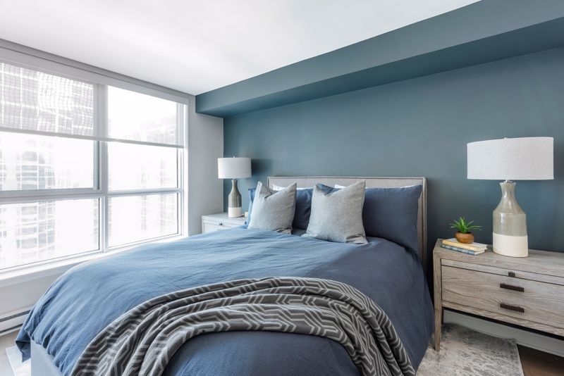 Blue Bed in a clean, spacious room