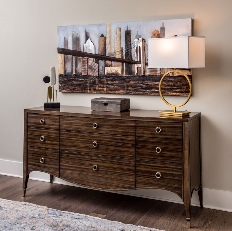 A dresser paired with a piece of art