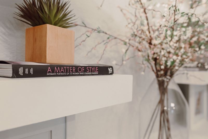 "A Matter of Style" on a white shelf