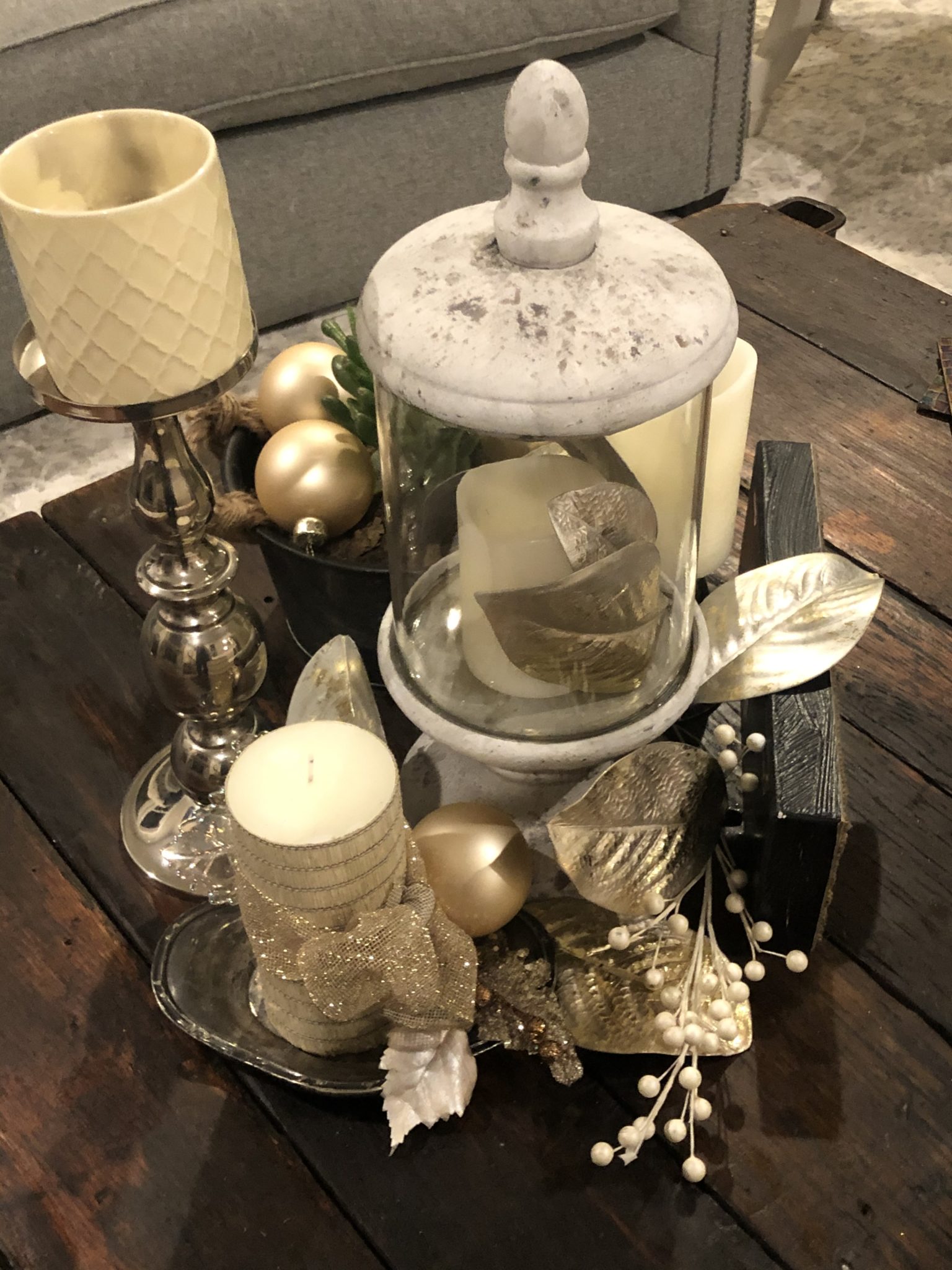 Decorative holiday candle arrangement on a table