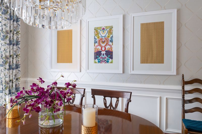 Paintings hung in a dining room