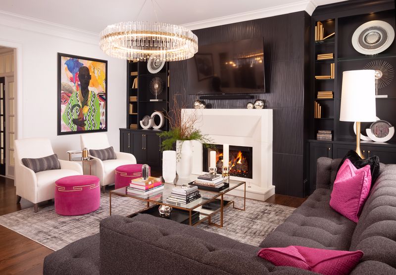 bright pink decor on a dark sofa