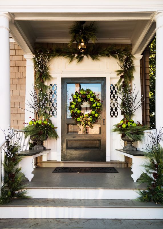front door with green apples and festive decorations