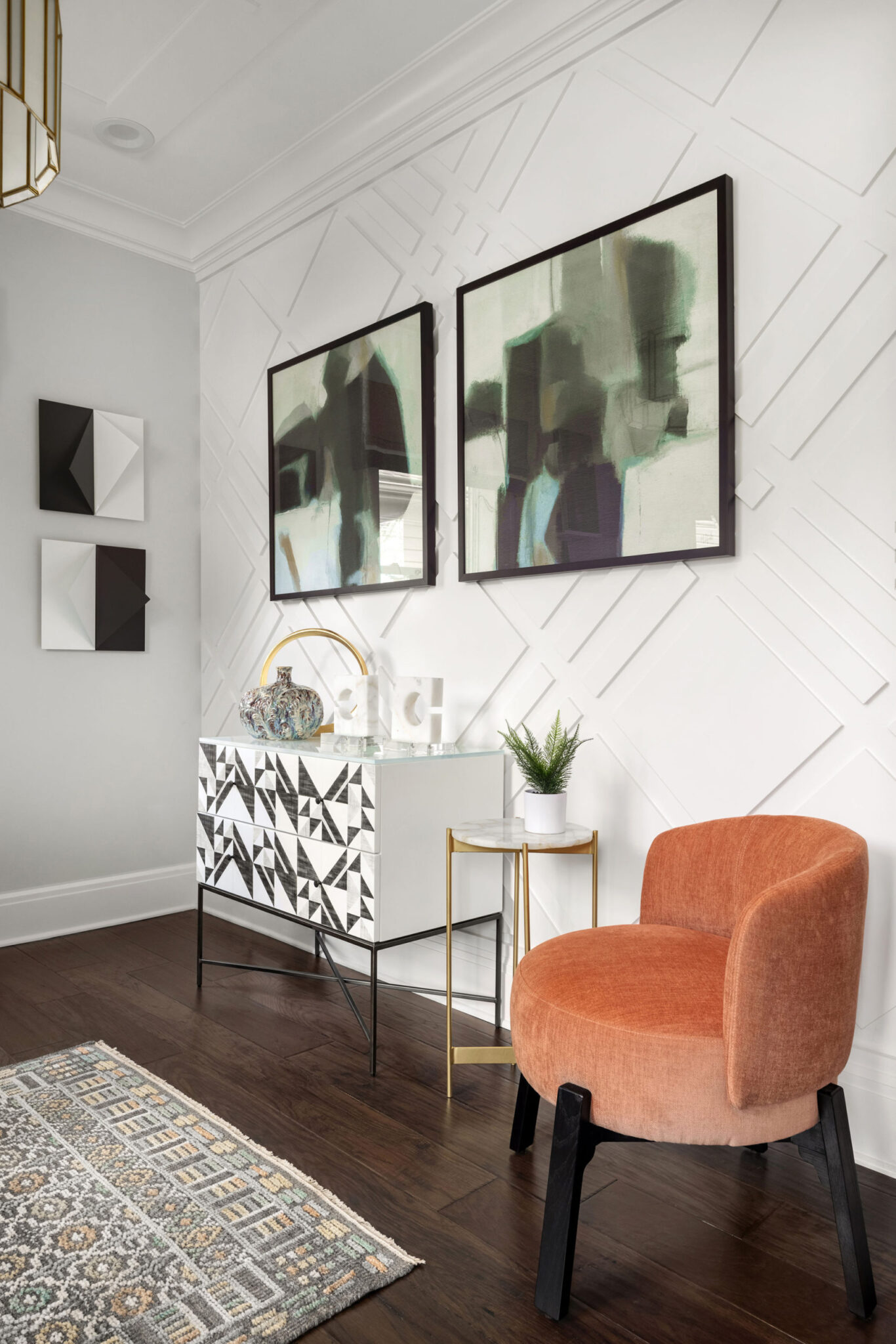 peach colored chair on hardwood floor set against modern white interior