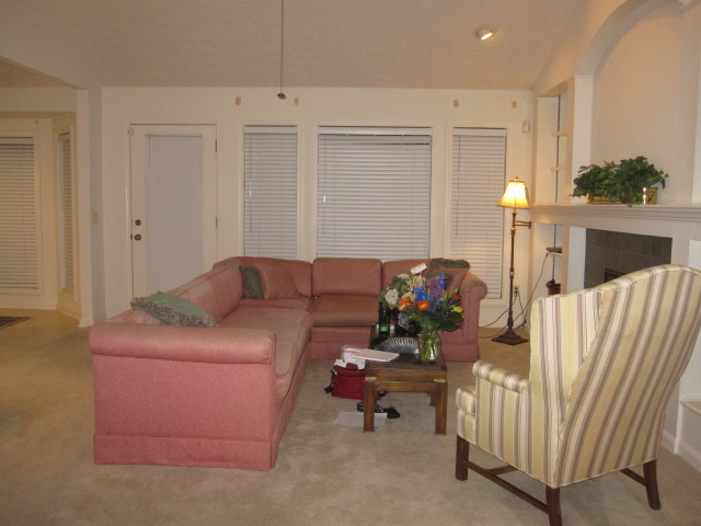 living room with pink couch and beige interior