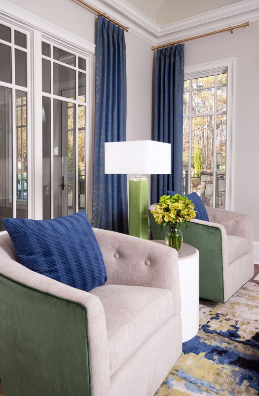 beige and green chairs with blue pillows and curtains as accent colors room interior
