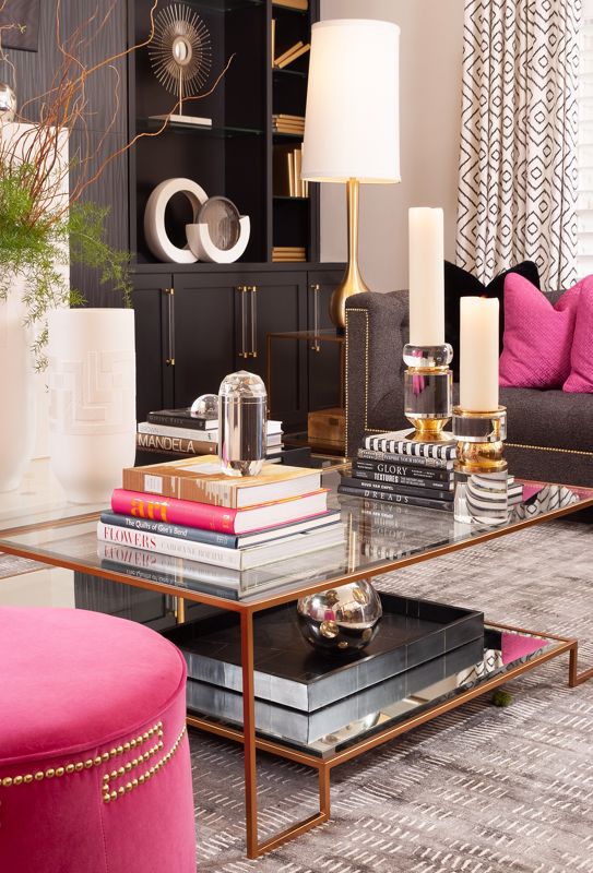 metal frame coffee table with glass top set against black and pink elegant furniture interior design Cincinnati