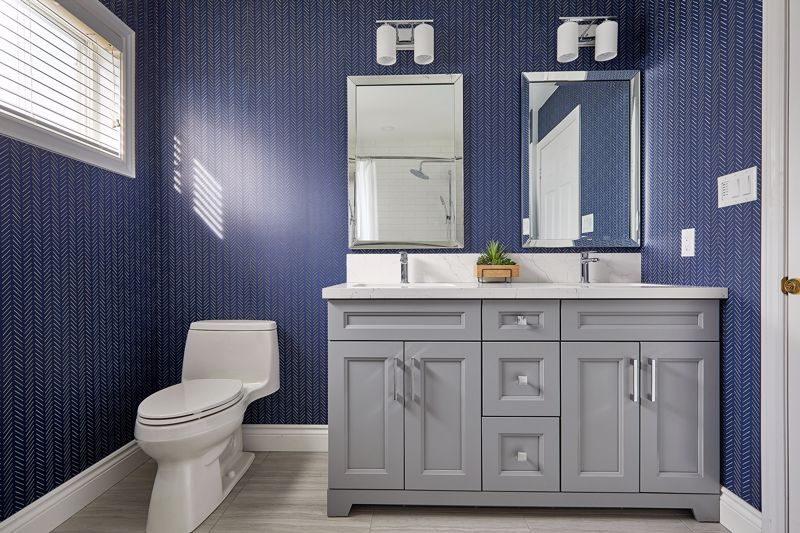 white gray and deep blue bathroom with tiny decorative pattern wallpaper interior design cincinnati