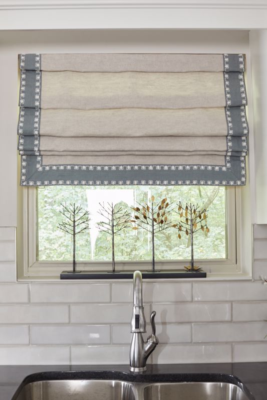 plain roman blinds showcasing one option for summer window treatments