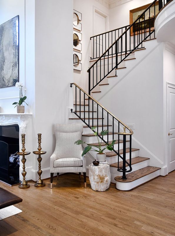 wrought iron banister staircase and metal ornaments on hardwood flooring showcasing metal decoration for interior design in Cincinnati