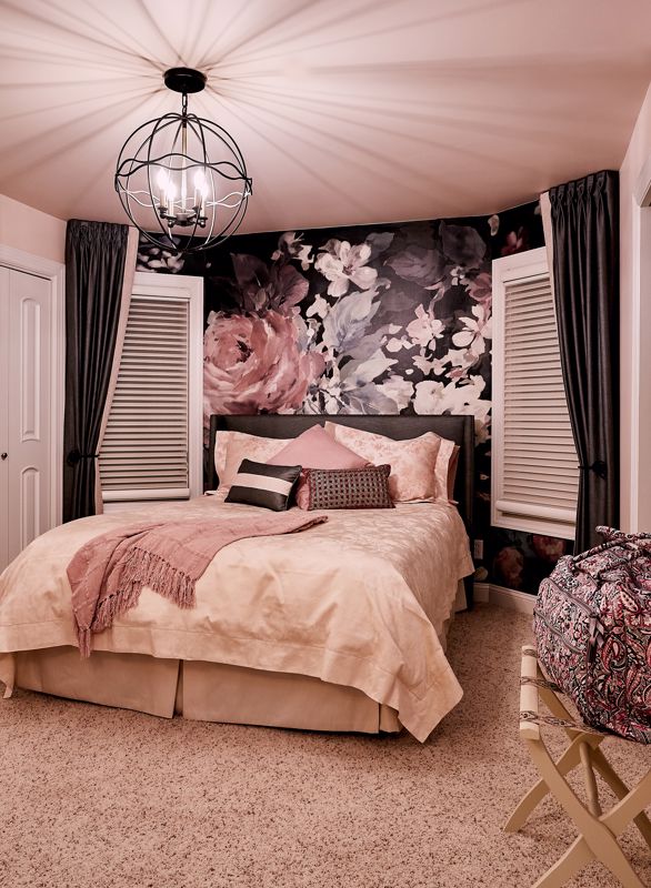 beige pink bed set against floral painted wall showcasing maximalist interior design style in Cincinnati OH home