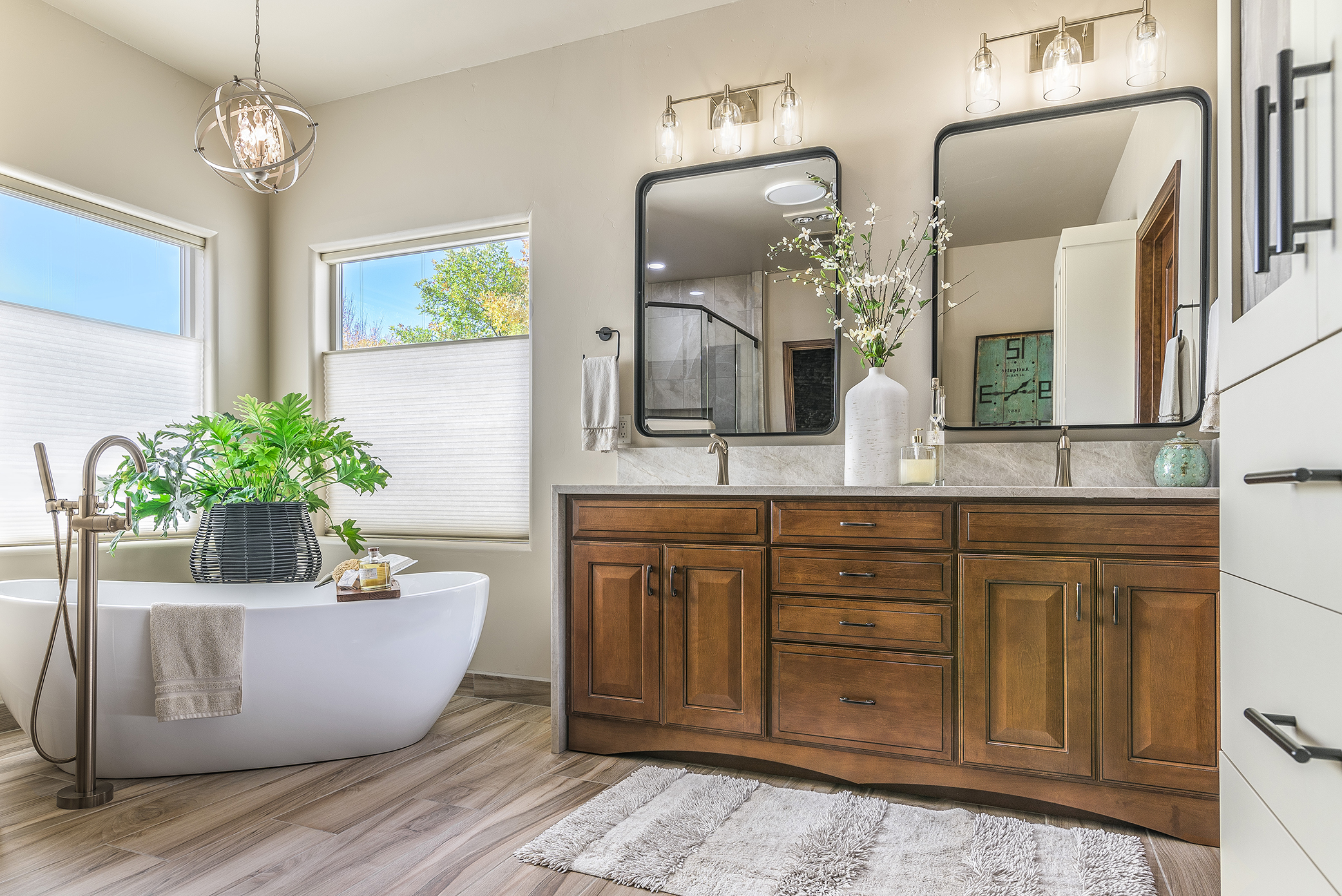 Rustic modern bathroom with his & hers sink and spa-like bathtub.